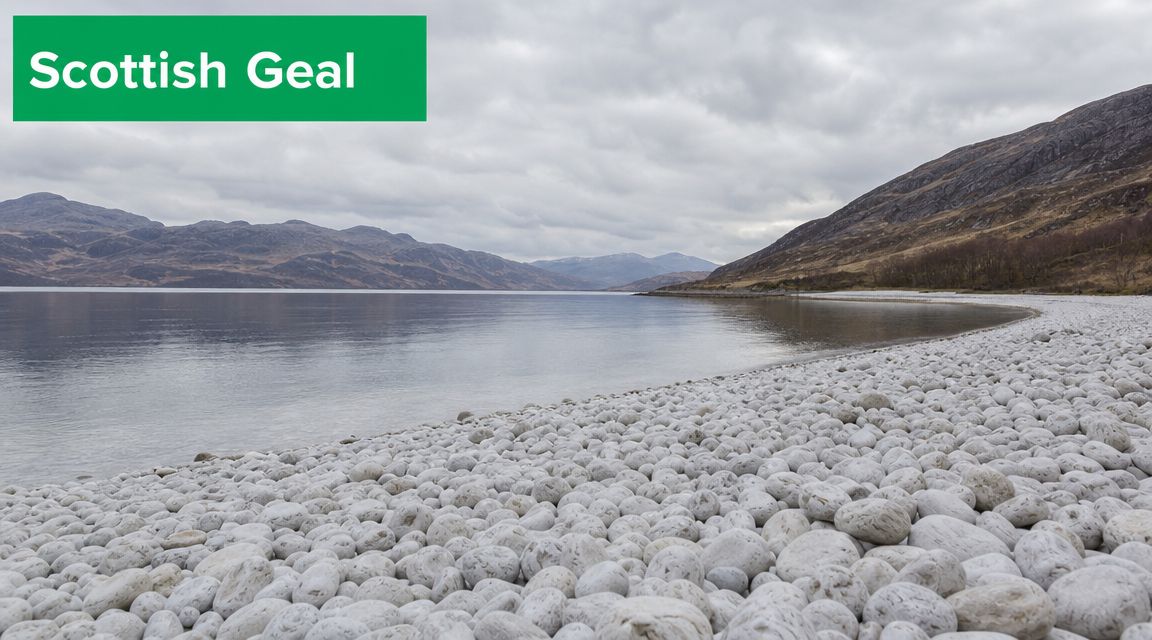 A serene Scottish loch shoreline filled with smooth white stones under a cloudy sky.