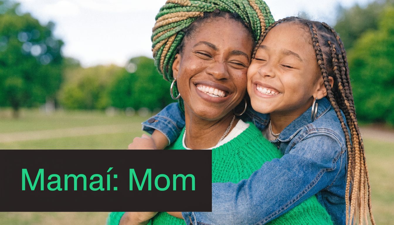 A happy mother with braided hair and her young daughter embracing outdoors in a park.