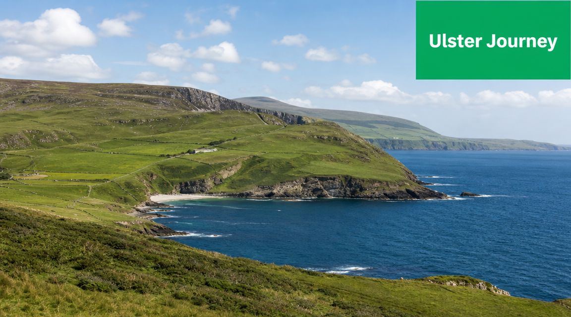 A scenic view of a green Irish coastline with rolling hills meeting the blue Atlantic Ocean.