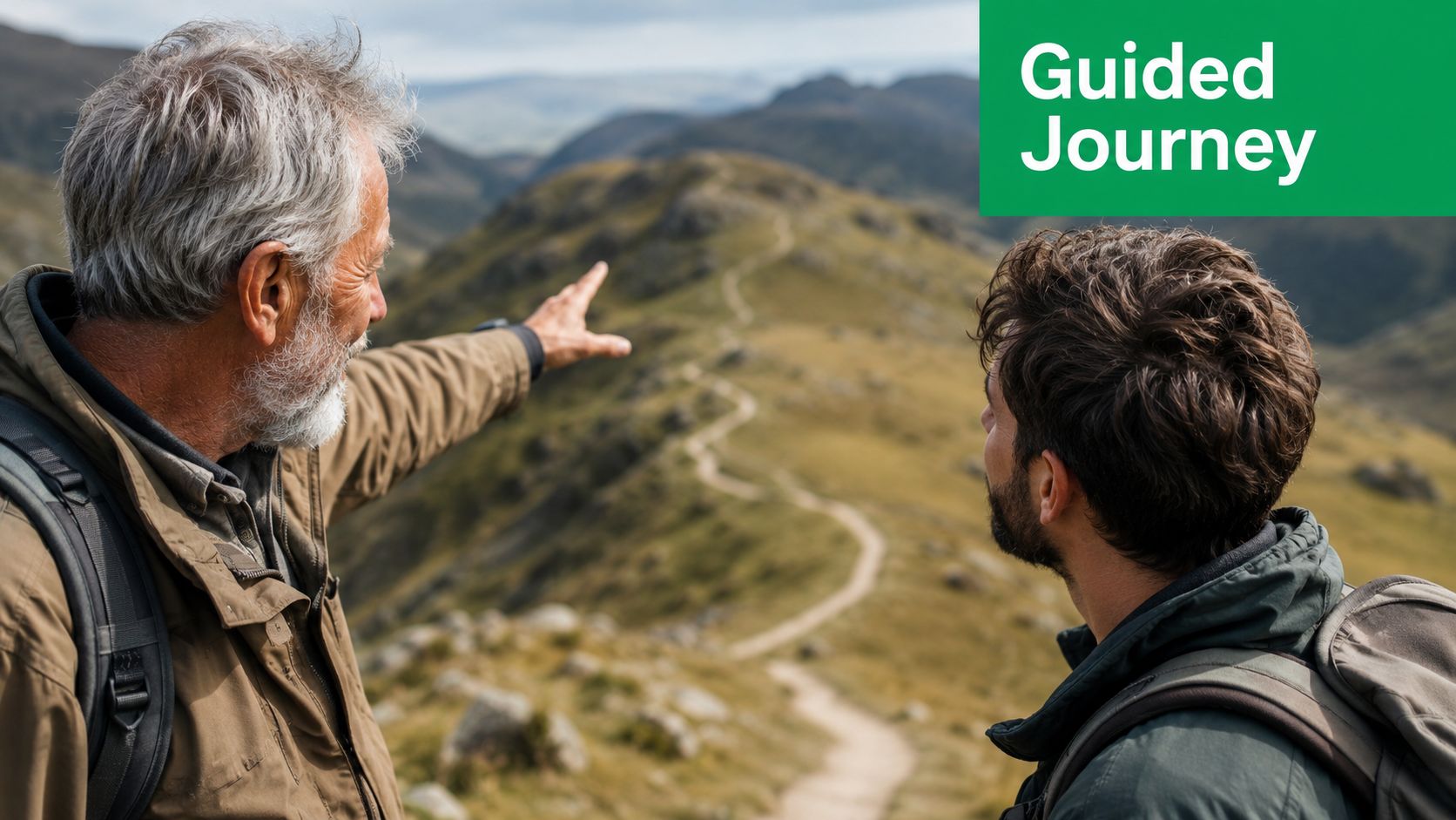 An older mentor pointing out a mountain path to a younger man during a hiking trip.