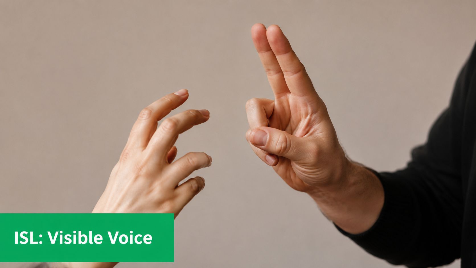 A close-up shot of two people communicating through the use of hand signs and gestures.