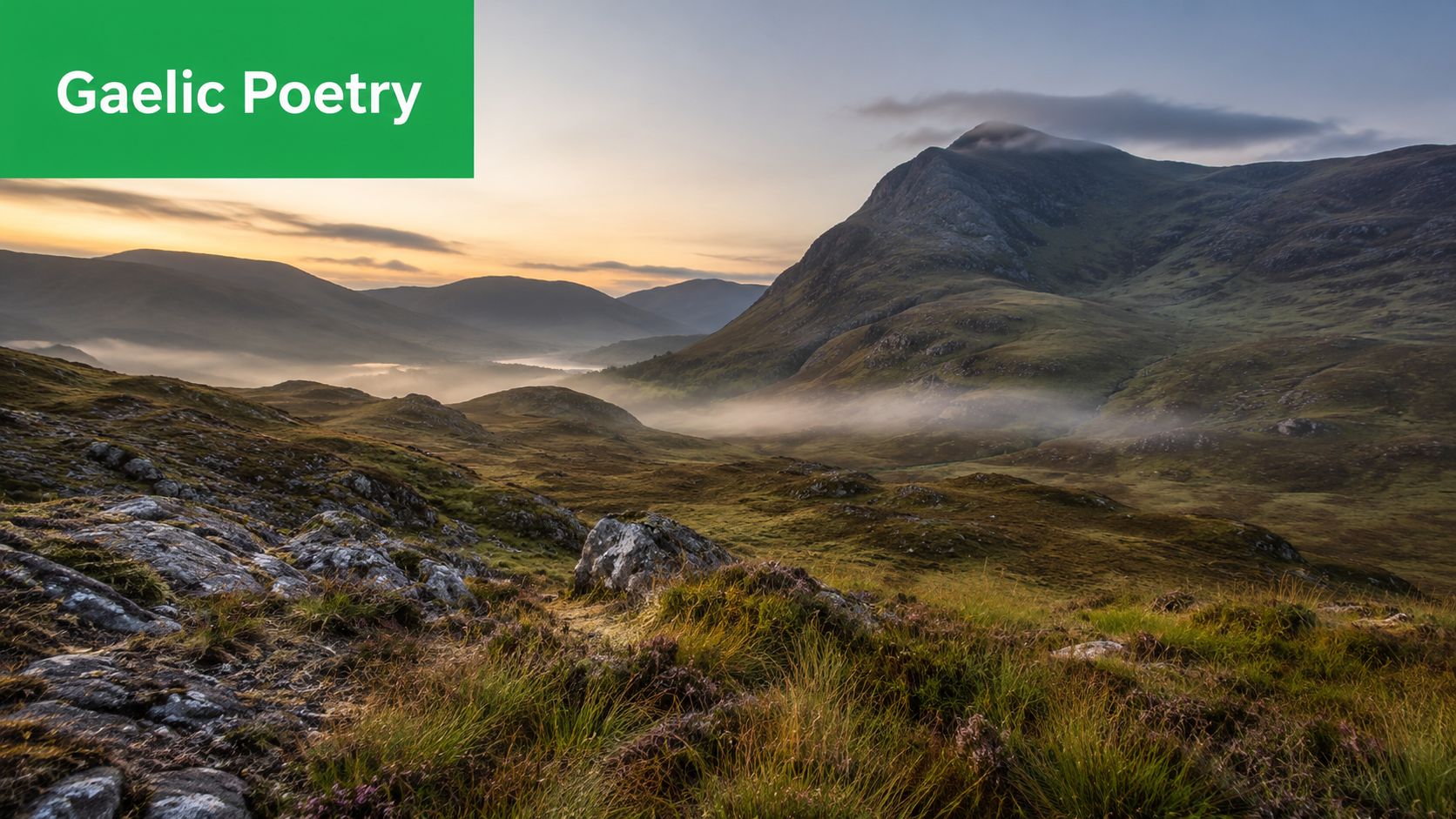 A scenic view of rolling Scottish Highlands with mist settling in a valley at sunset.